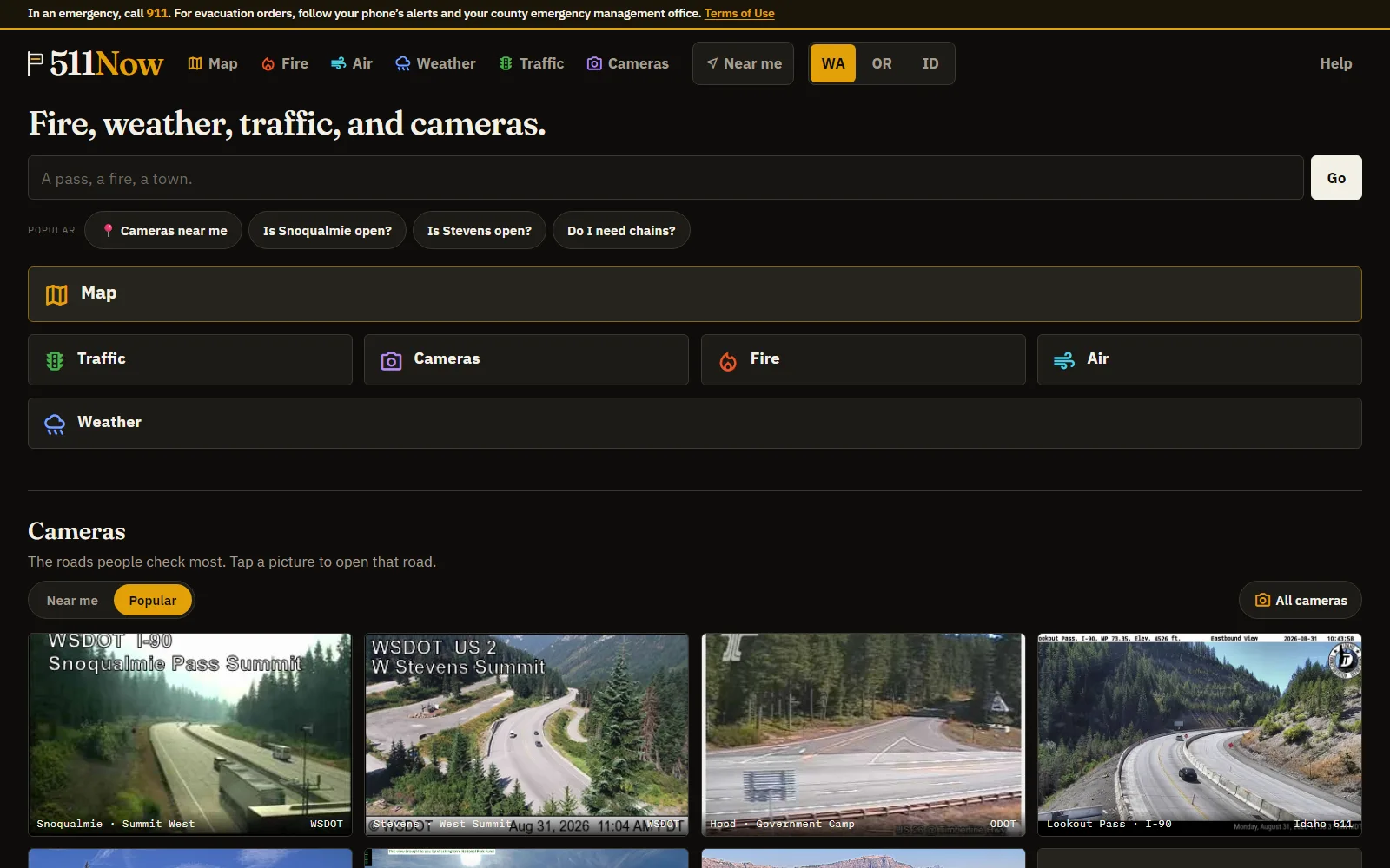 The 511now homepage: a search bar, quick answers like 'Is Snoqualmie open?', and a row of live WSDOT and ODOT mountain pass cameras