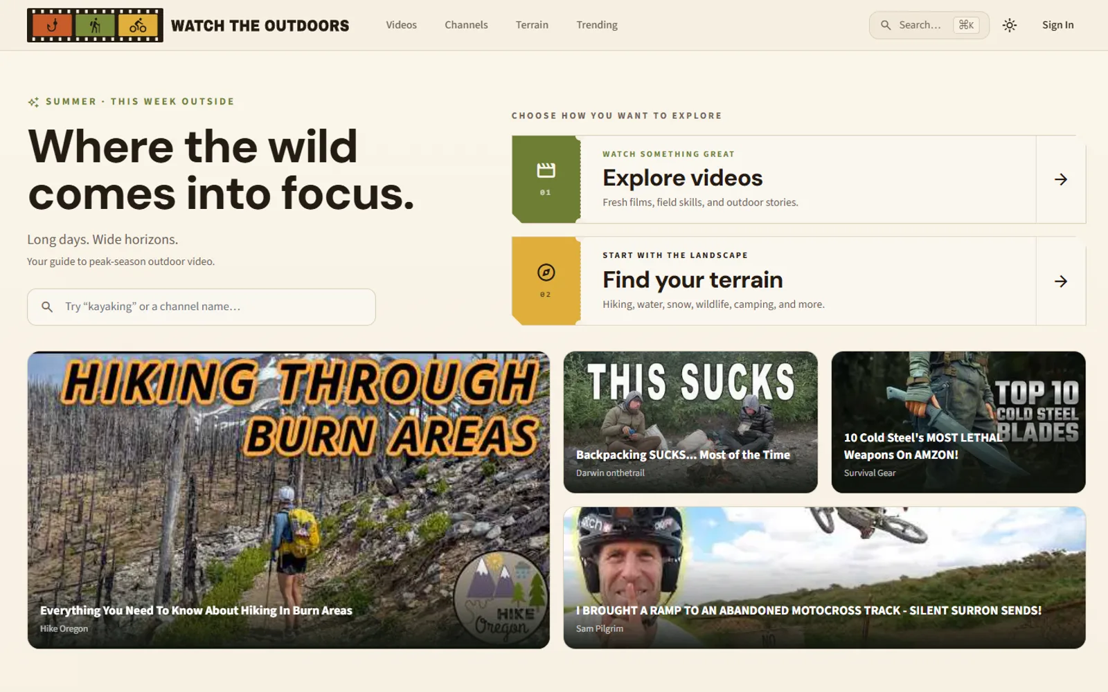 WatchTheOutdoors homepage: 'Where the wild comes into focus' with entry points for browsing videos and terrain, above a grid of curated outdoor video thumbnails